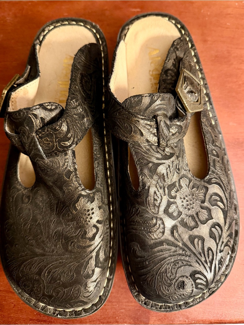 Women’s Alegria Black Embossed Leather Mules, Bronze Accents & Buckle, Size 38